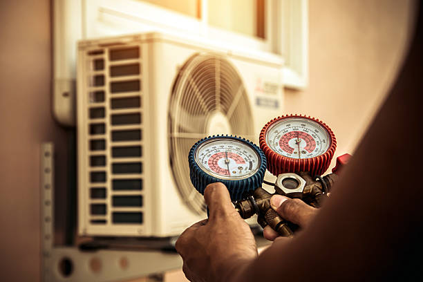 Professional Air Conditioning Service technician working in Pulaski, NY